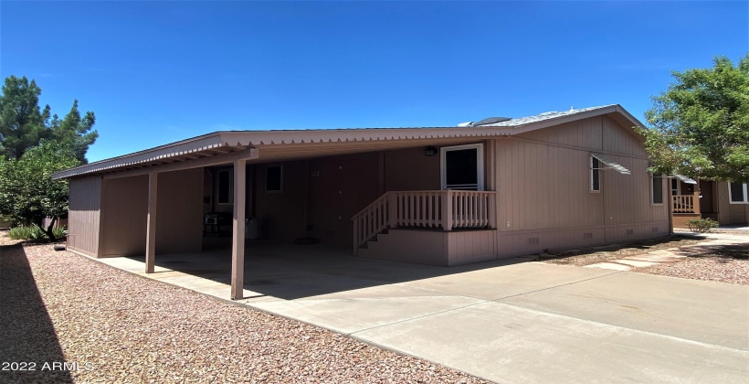 Space for two vehicles and a third under carport