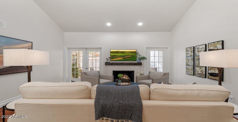 Living room with fireplace and french doors