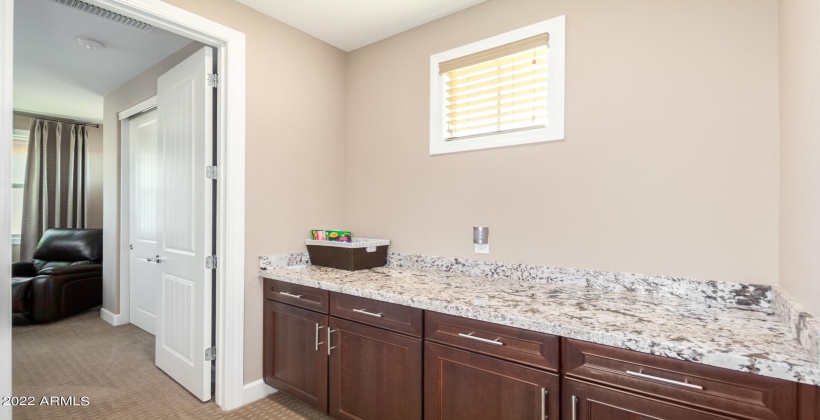 Entrance from the garage with charging station USB outlets - granite countertop