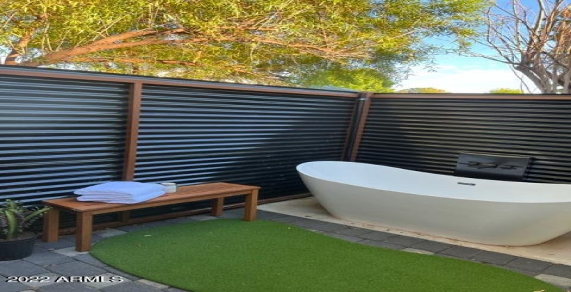 Private outdoor soaking tub off master bedroom.