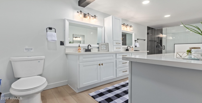 Master bath with walk in shower and soaking tub. Dual vanities.