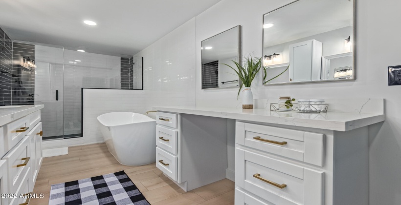 Master bath with walk in shower and soaking tub. Dual vanities.