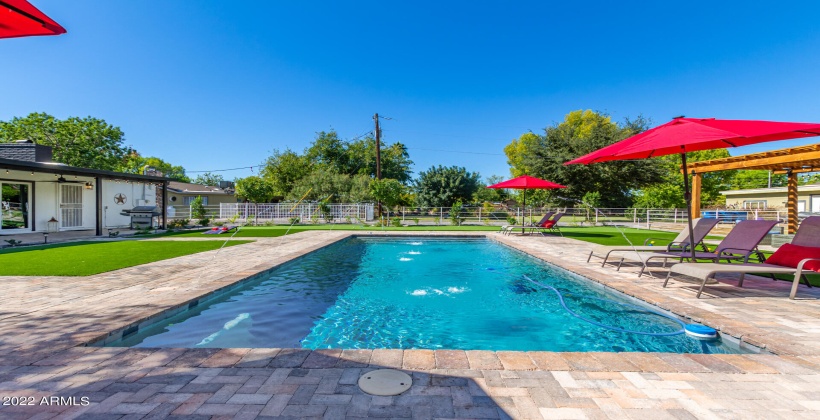 Resort size pool with pavers.