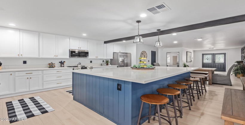 Oversized island for entertaining. New stainless steel appliances