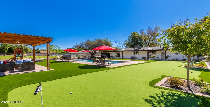 Huge putting green in this one of a kind home.